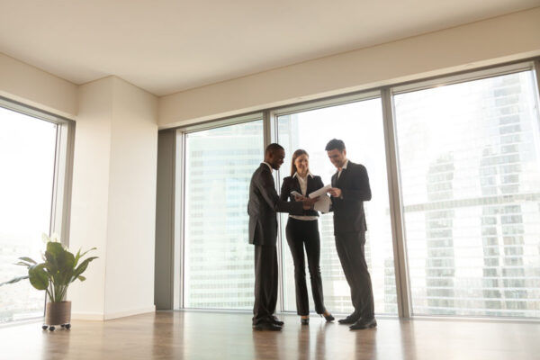 real estate agents wait for client to show office for rent