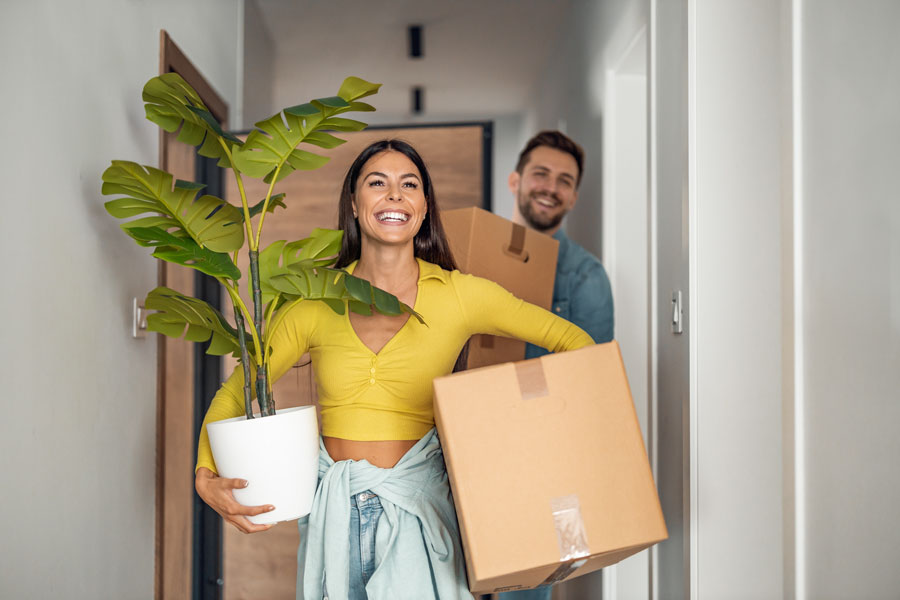 Young couple moving in new home.C