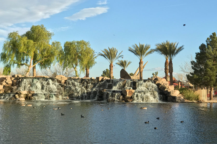 Aliante Nature Discovery Park, a 20-acre park with tennis and volleyball courts plus a lake, waterfall and dinosaur-themed kids area. North Las Vegas, Nevada. File photo: JamesEdward, Shutter Stock, licensed.