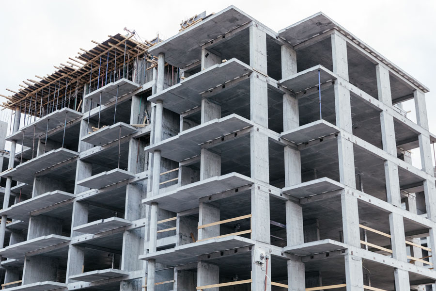 Unfinished residential buildings. gray cement slab. bottom view. Mortgage loan